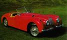 La Jaguar XK 120 Roadster rouge en miniature de Burago au 1/24e